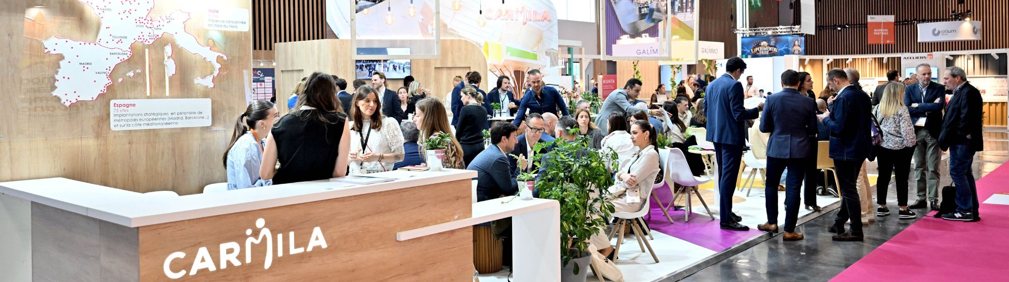 Carmila stand at SIEC trade show, a professional networking space welcoming visitors and partners focused on retail real estate solutions.