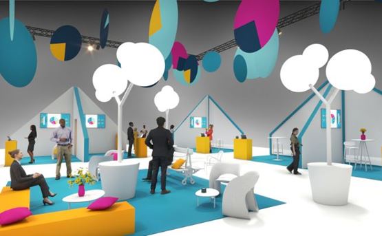 A modern and colorful space at a professional trade show, decorated with white tree-shaped structures, yellow and blue designer furniture, and visitors interacting.