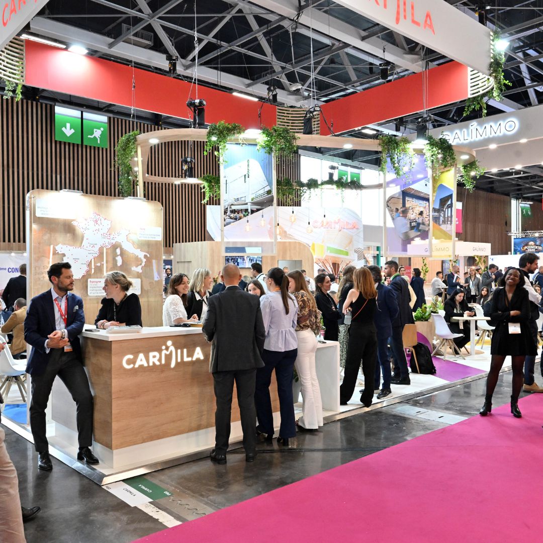 Carmila stand at SIEC trade show, a professional networking space welcoming visitors and partners focused on retail real estate solutions.